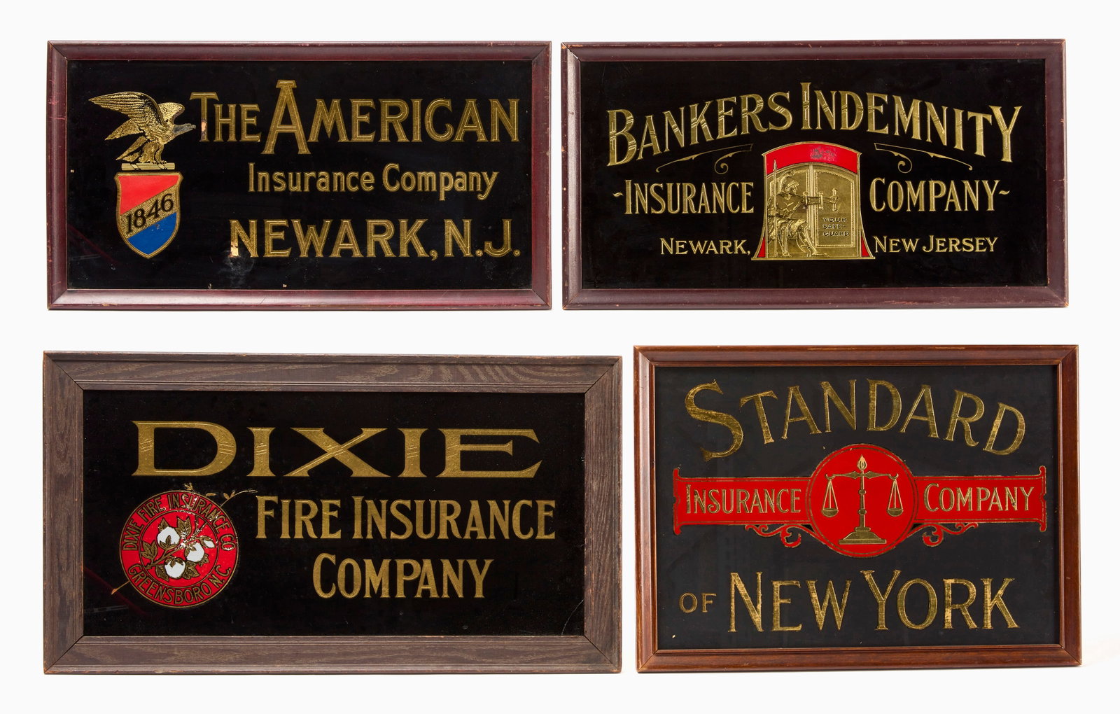 Four Graphic Glass Insurance Signs: Four glass insurance signs. Reverse-painted glass in original wood frames. The American Insurance Company (Newark, NJ), Dixie Fire Insurance Company (Greensboro, NC), Bankers Indemnity Insurance