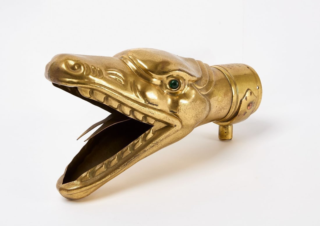 Boa Constrictor Car Horn: 'Boa Constrictor' car horn in the shape of a snake head with forked tongue. Martin Signal company stamp. Green glass eyes. England, early 20th century. H 6-1/4 in. L 11-1/4 in. 