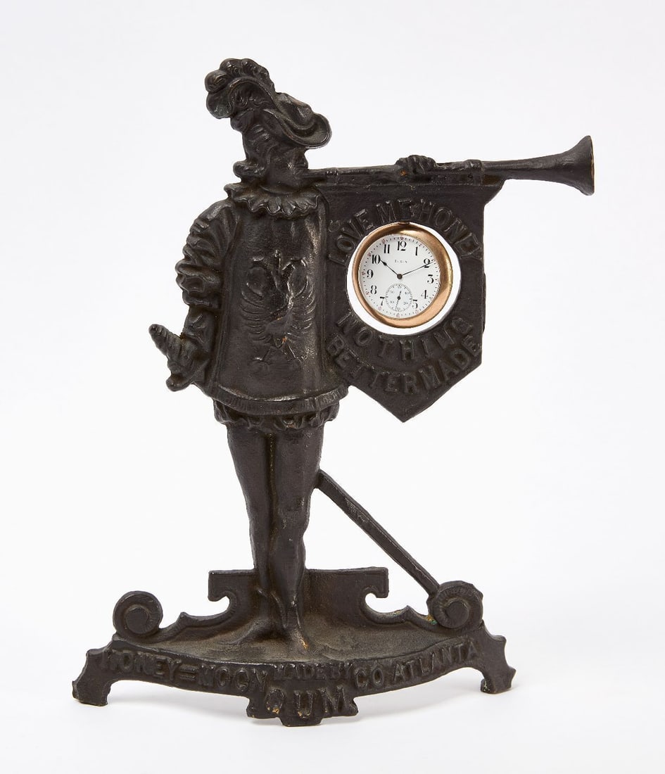 Honey Moon Gum Figural Bronze Watch Holder: Honey Moon Gum figural cavalier with horn and sword pocket watch holder/countertop display. Cast bronze with original paint. 'Love Me Honey - Nothing Better Made' slogan encircles the
