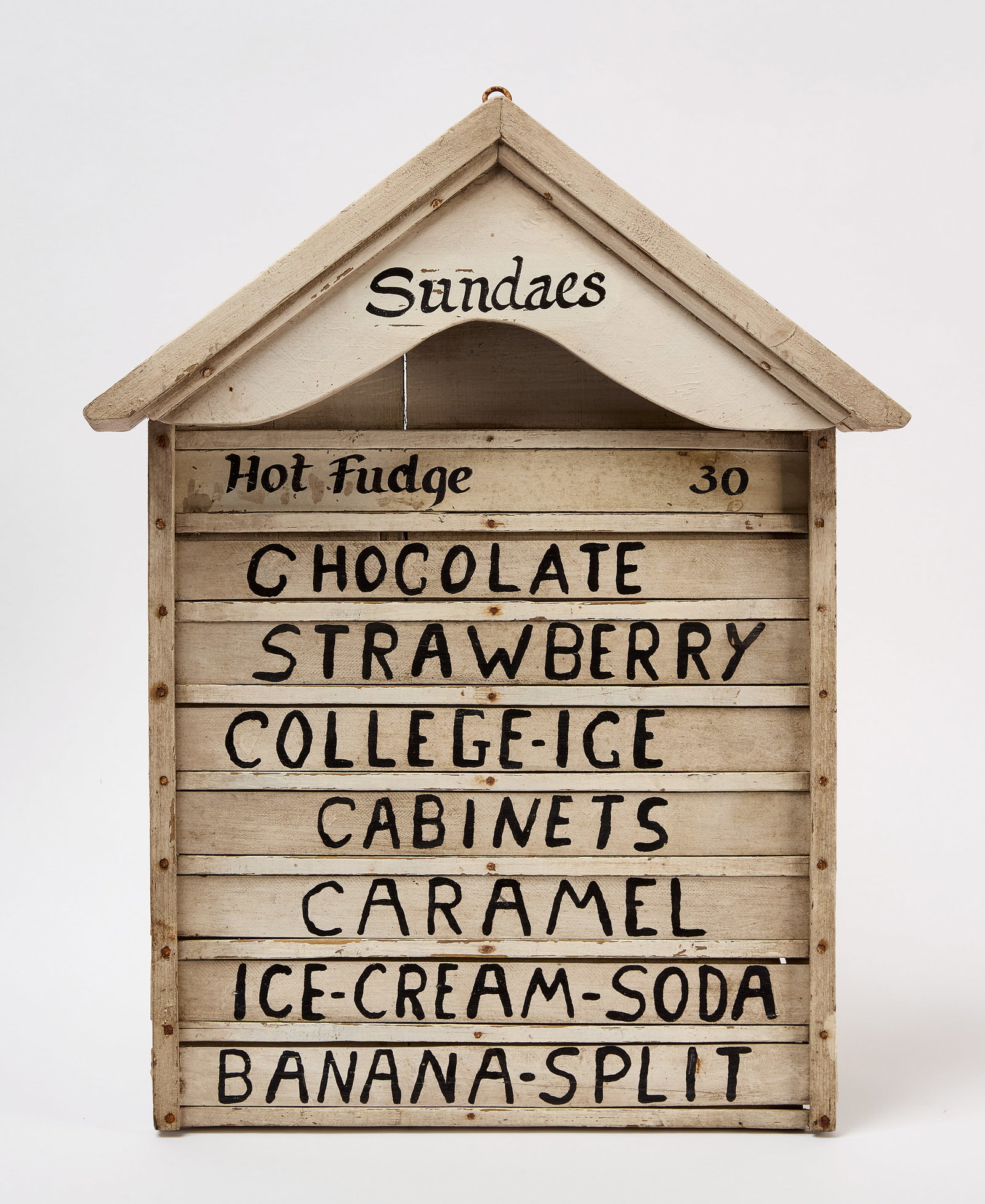 Ice Cream Menu Board Sign: Early ice cream menu board with an awning-type top. Wood, in original white paint and eight slide-out selections. Probably Rhode Island, first half 20th century. H 21 in. W 16-1/2 in. D 3-3/8 in.