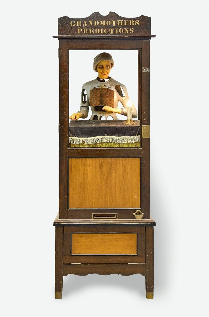 Grandmothers Predictions 5-Cent Fortune Teller Machine: 'Grandmother's Predictions' 5-cent fortune teller machine. Original wax head and hands, plus a pair of replacement hands. When operating, grandma would turn her head and move her hands ove