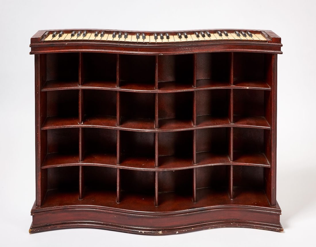 Piano Form Store Display Shelf: Serpentine store display shelf with piano keyboard top and a total of 24 individual compartments. Wood with original paint. American, circa 1920-30. H 31-1/2 in. W 40-1/4 in. D 11 in. Ea compartment: