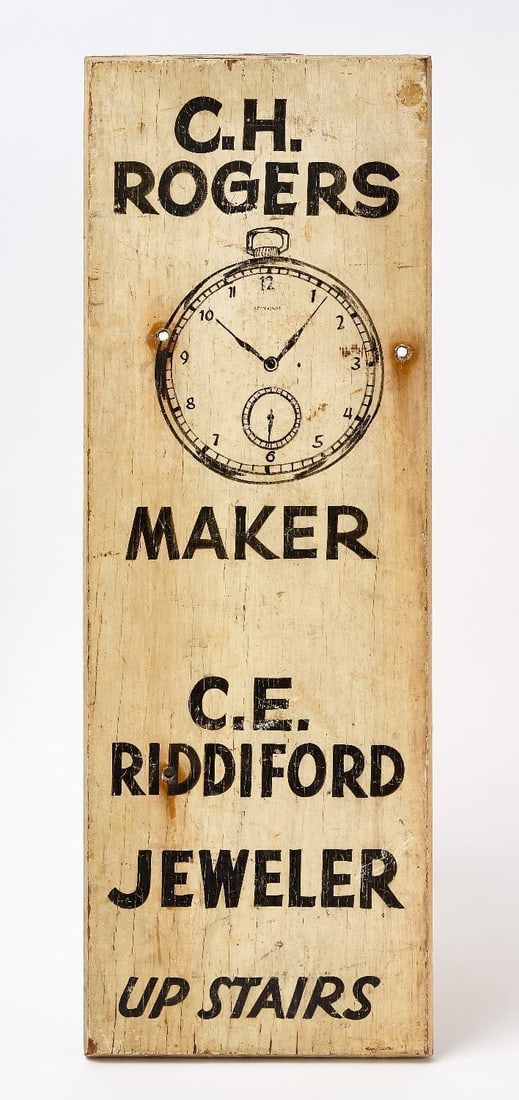 Watch Maker Trade Sign: Watch maker trade sign with pocket watch graphic. Original paint on wood board. Connecticut, circa 1920. H 29-5/8 in. W 10-3/8 in. Searches for C. E. Riddiford will produce ties to New Milford, Conn.