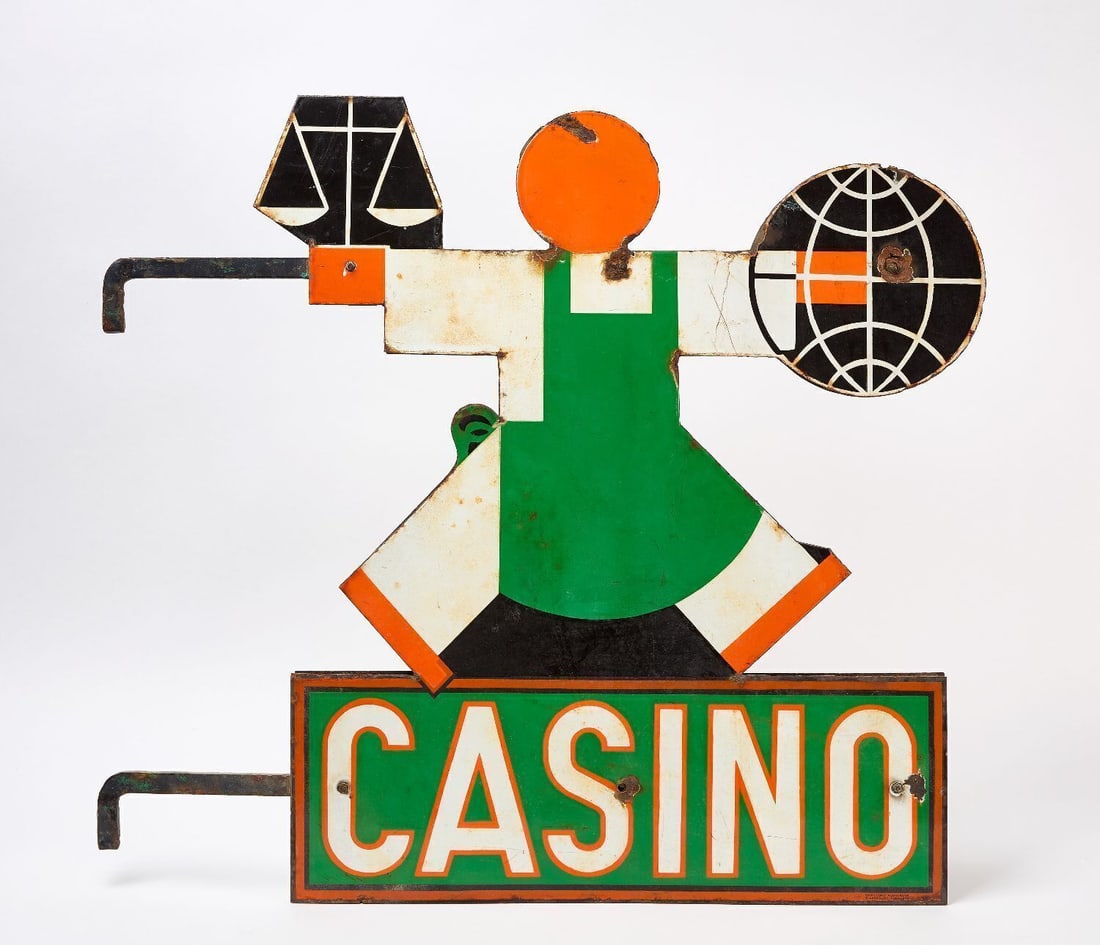 Double-Sided Casino Porcelain Sign: Casino porcelain sign of a figure holding a balance and a globe. Two identical porcelain signs mounted to original wall bracket. H 29-1/2 in. W 32-1/4 in.