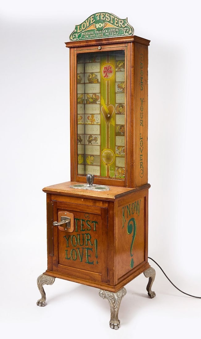 Love Tester Coin-Op Arcade Machine: Love Tester coin-op arcade machine. Operates with a quarter. Appears to have a period interior panel and reproduction-style case. Resting on cast iron claw feet. American, second half 20th century.