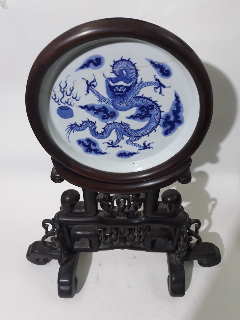 A chinese B-W round display panel on wooden stand (1 of 5)