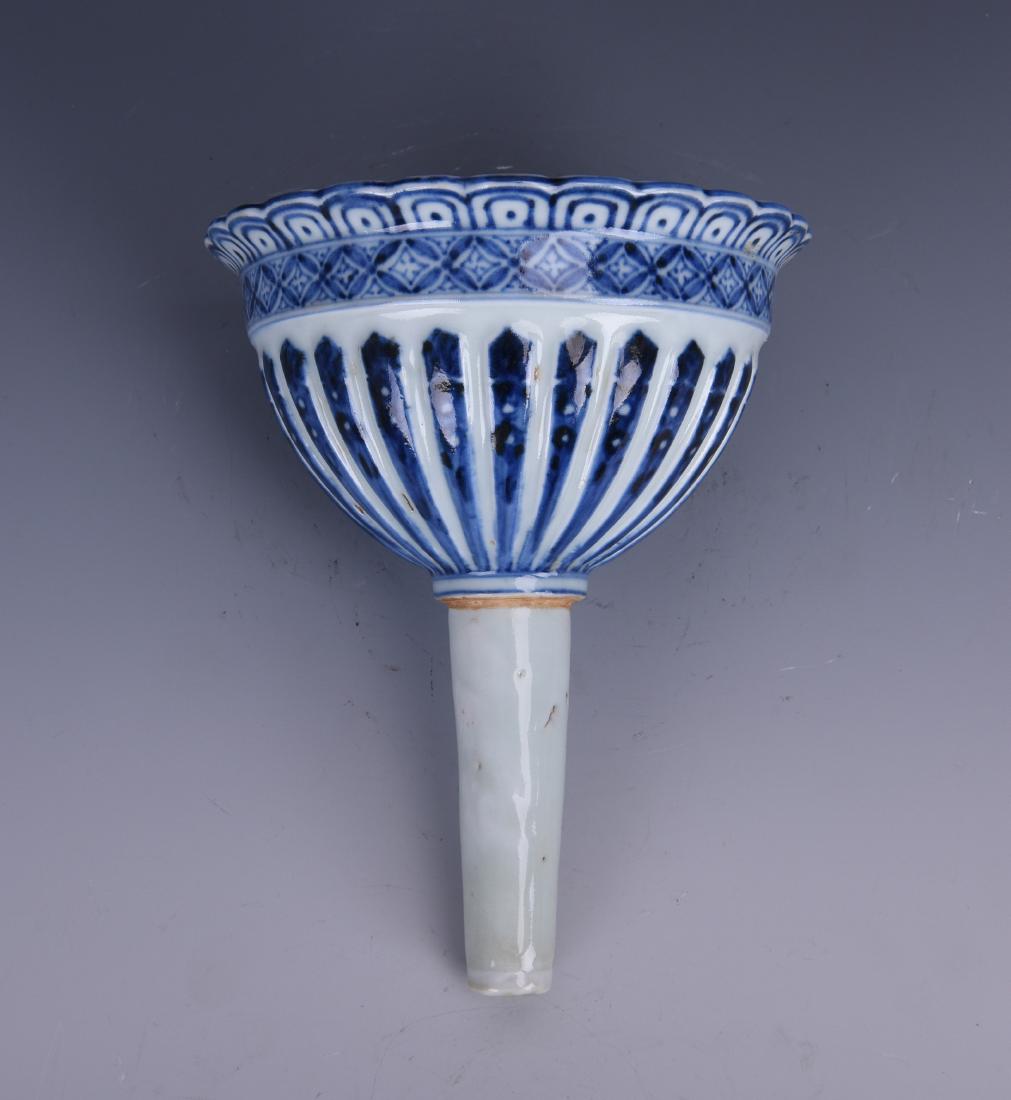 A VERY RARE BLUE AND WHITE FUNNEL, EARLY MING DYNASTY (1 of 9)
