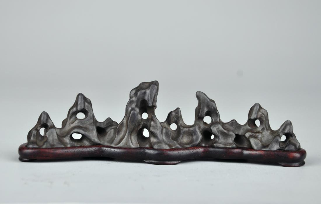 A DUAN STONE BRUSH REST AND ZITAN STAND, QING DYNASTY (1 of 6)