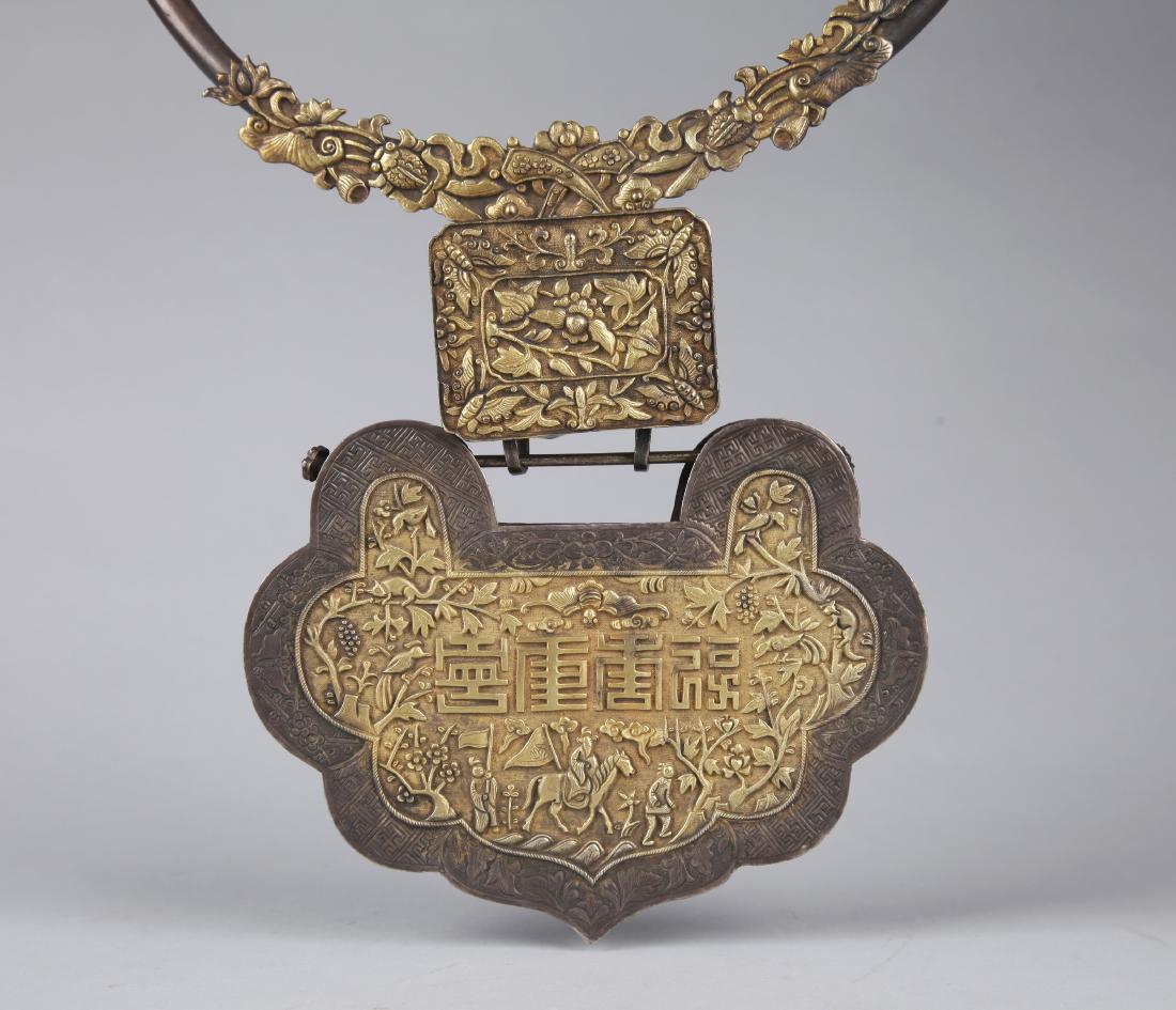 A SILVER BRACELET AND PENDANT, QING DYNASTY (1 of 9)