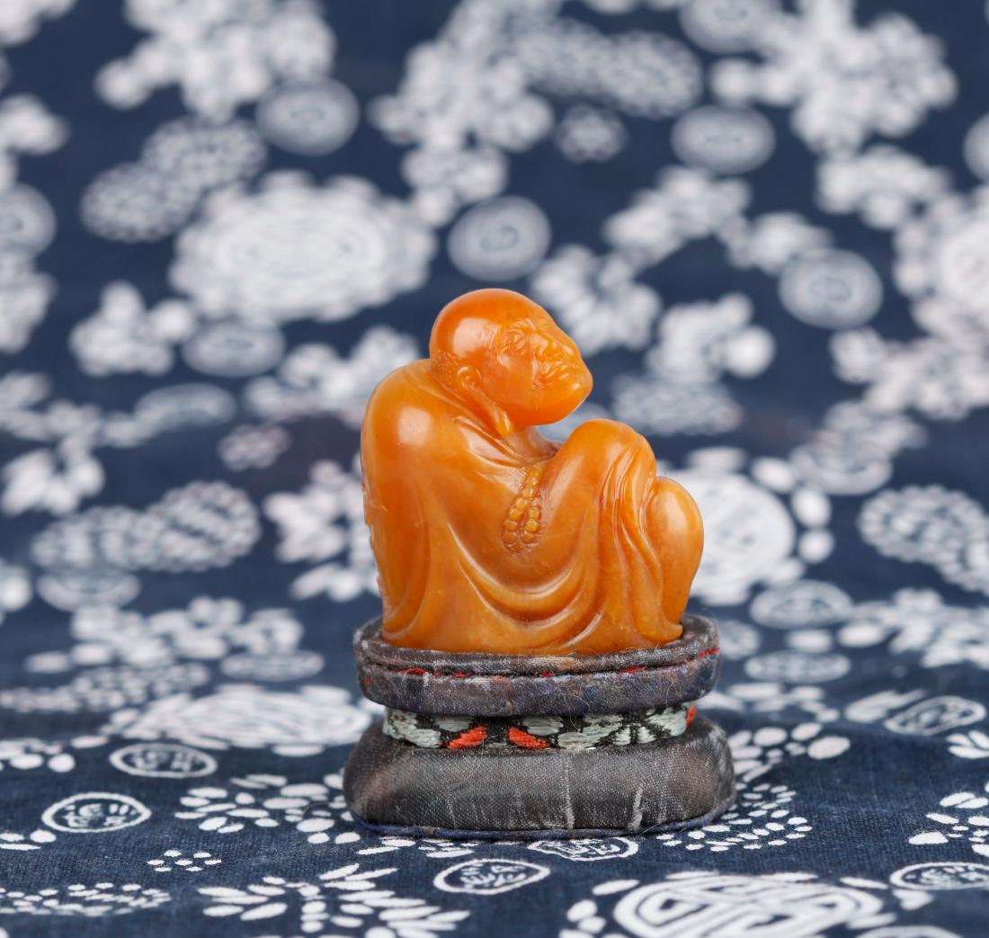 A TIANHUANG FIGURE OF LUOHAN, SIGNED 'FANG JIE QI', (1 of 9)