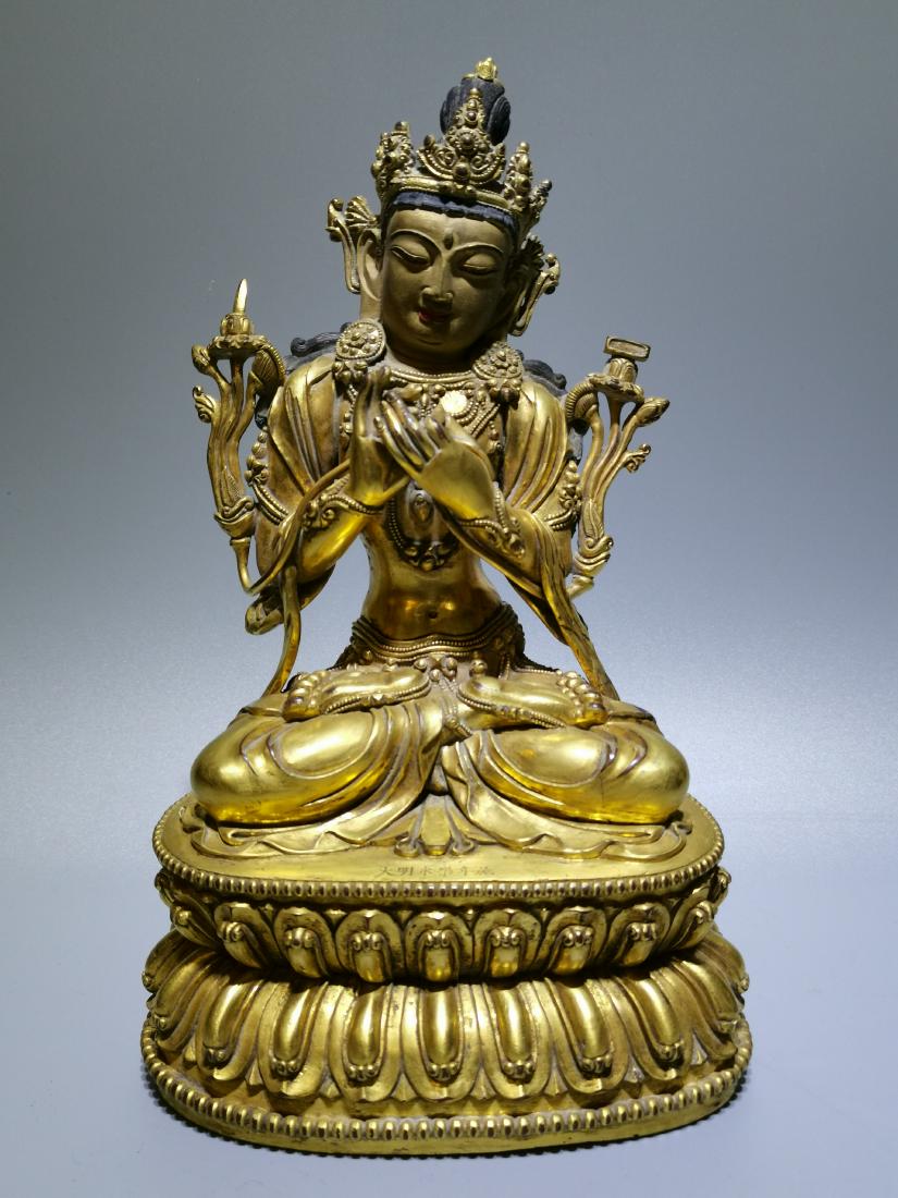 A CHINESE GILT BRONZE FIGURE OF MANJUSRI, QIANLONG (1 of 7)