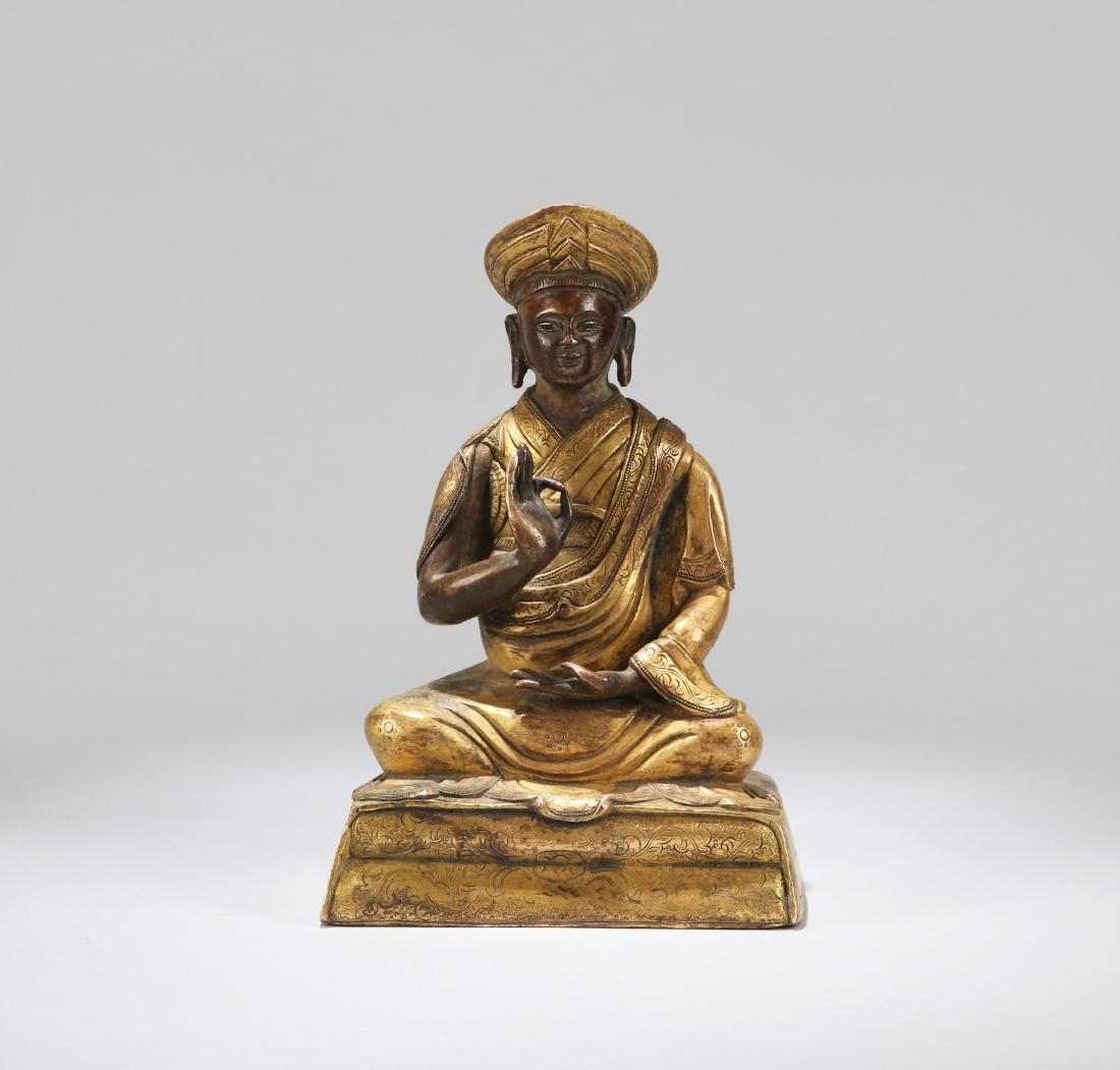 A CHINESE GILT BRONZE FIGURE OF A GURU, 18TH CENTURY (1 of 9)