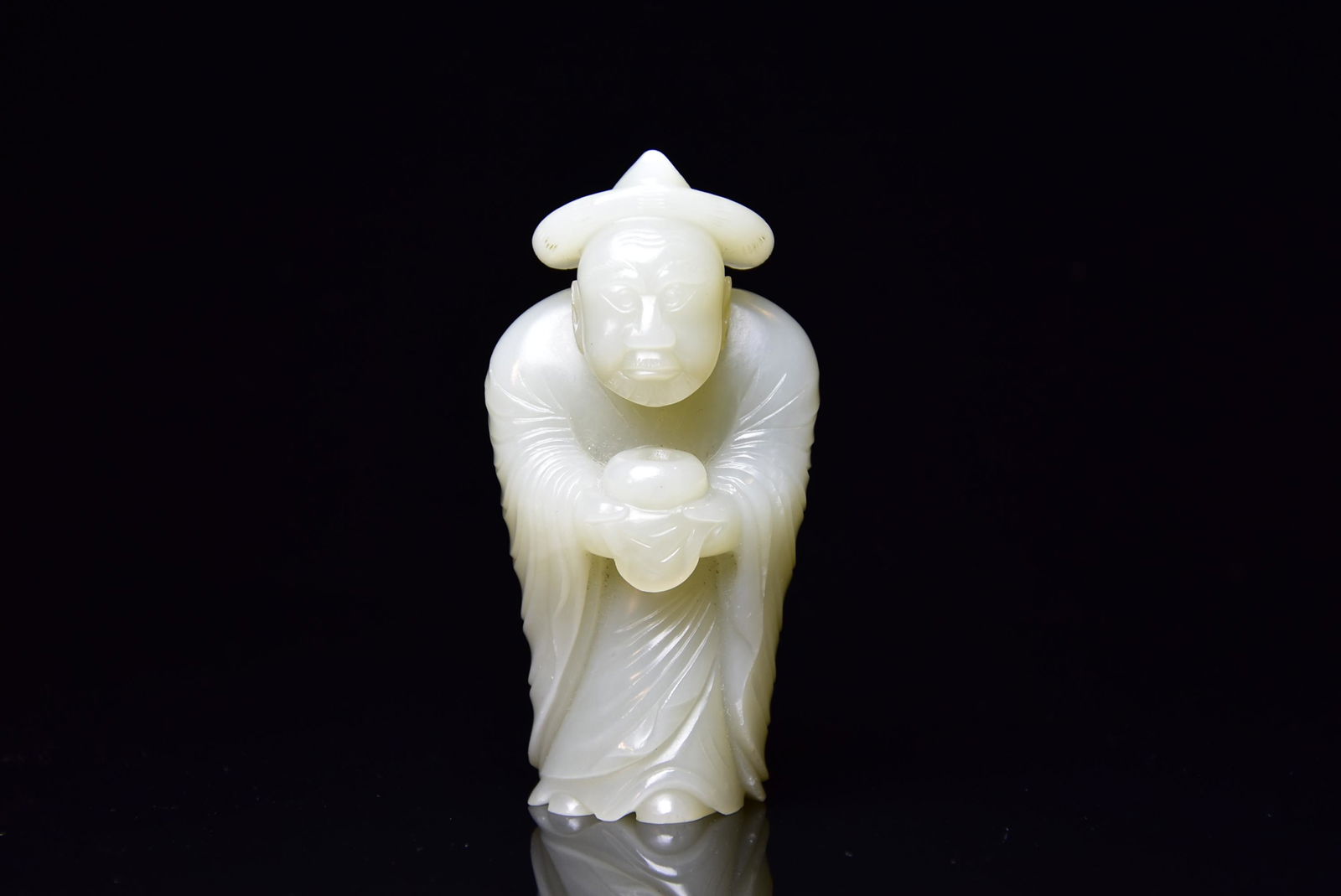 A CHINESE CARVED WHITE JADE FIGURE, QING DYNASTY (1 of 5)