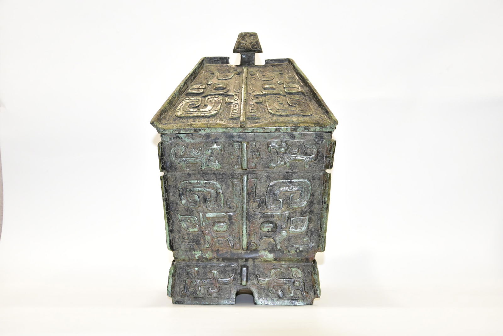 A CHINESE ARCHAISTIC BRONZE FANG GUI (1 of 6)