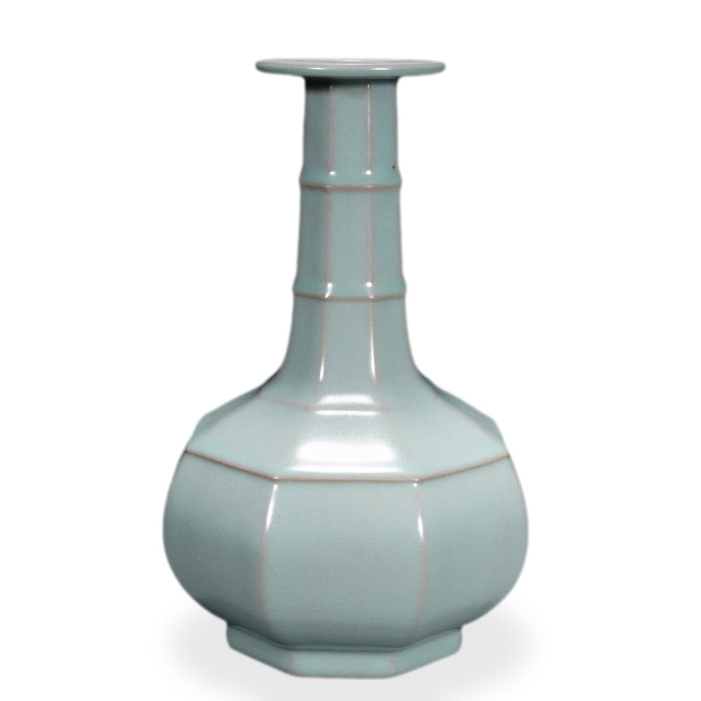 SONG DYNASTY RU WARE SKY-BLUE GLAZED OCTAGONAL VASE WITH RAISED BOWSTRING BANDS: 8 7/8 x 5 7/8 in (22.5 x 15 cm) Song Dynasty Ru Ware Sky-Blue Glazed Octagonal Vase with Raised Bowstring Bands Dimensions: H: 8 7/8 in (22.5 cm); W: 5 7/8 in (15 cm) This rare and refined octagonal