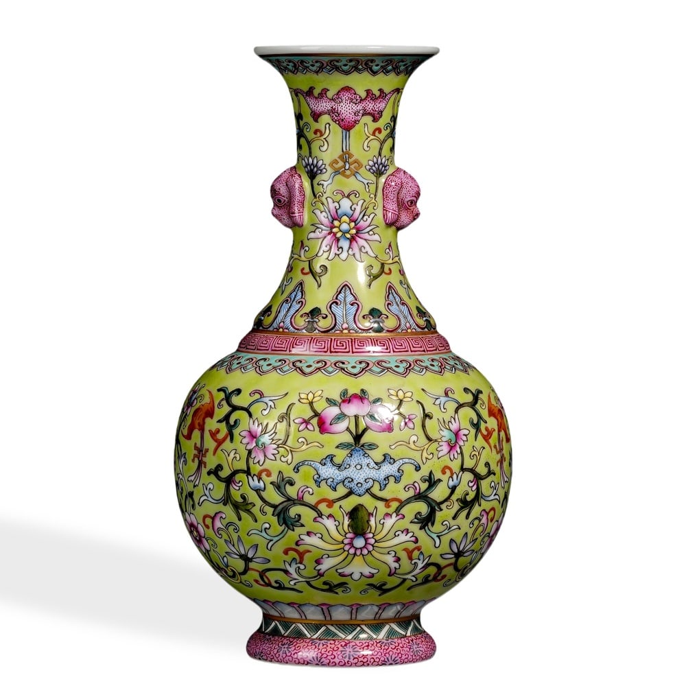 QIANLONG FAMILLE ROSE 'WESTERN LOTUS SCROLL' VASE ON GREEN GROUND: 7 1/2 x 4 in (19 x 10 cm) Qianlong Famille Rose 'Western Lotus Scroll' Vase on Green Ground Dimensions: W: 4 in (10 cm); H: 7 1/2 in (19 cm) This refined small vase exemplifies the precision of Qianlo