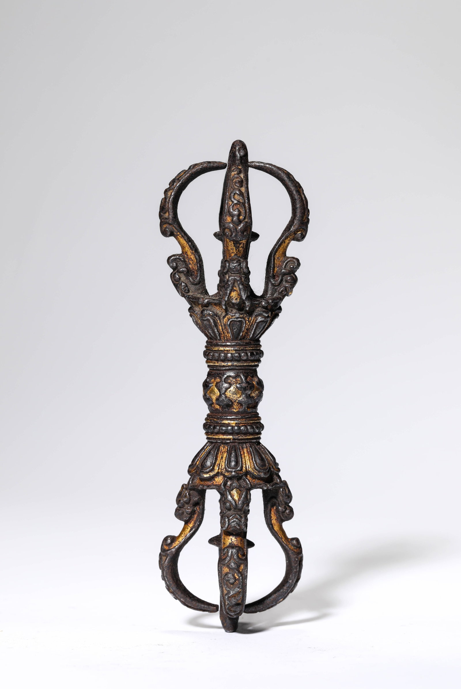 A TIBETAN GILT-IRON FIVE-PRONGED VAJRA (1 of 4)