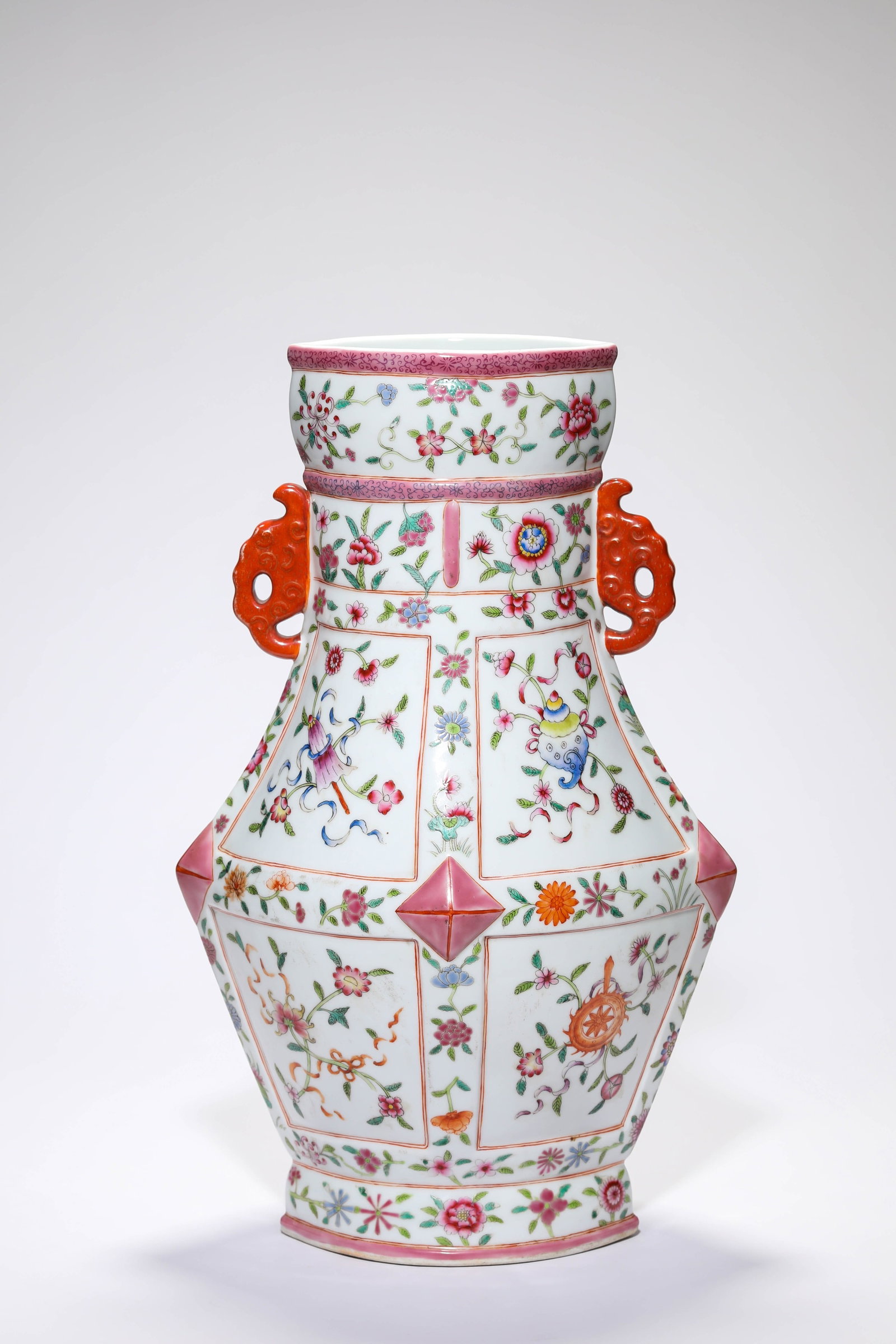 A FAMILLE-ROSE 'EIGHT TREASURES' ELEPHANT-HANDLE VASE: LENGTH 24.1 CM × WIDTH 18 CM × HEIGHT 39 CM