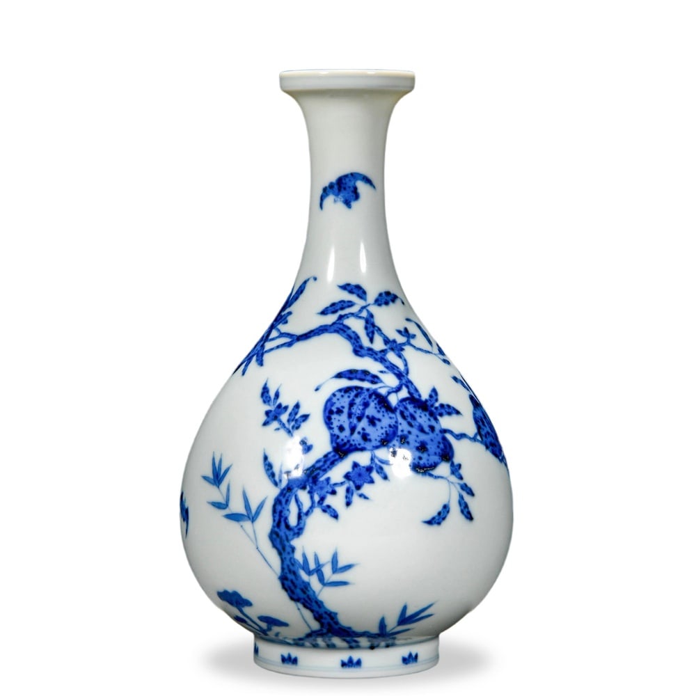 QIANLONG BLUE AND WHITE 'FIVE BATS AND NINE PEACHES' YUHUCHUN VASE: Qianlong Blue and White 'Five Bats and Nine Peaches' Yuhuchun Vase Dimensions: H: 7 3/4 in (20 cm); W: 4 1/4 in (11 cm) This refined yuhuchun vase exemplifies the elegant proportions of the form most 