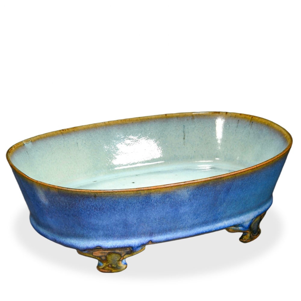 SONG DYNASTY JUN WARE LAVENDER-GLAZED NARCISSUS BASIN: Song Dynasty Jun Ware Lavender-Glazed Narcissus Basin Dimensions: H: 3 in (7.5 cm); W: 9 1/4 in (23.5 cm) This refined oblong basin is among the most aesthetically distilled forms produced at the Jun 