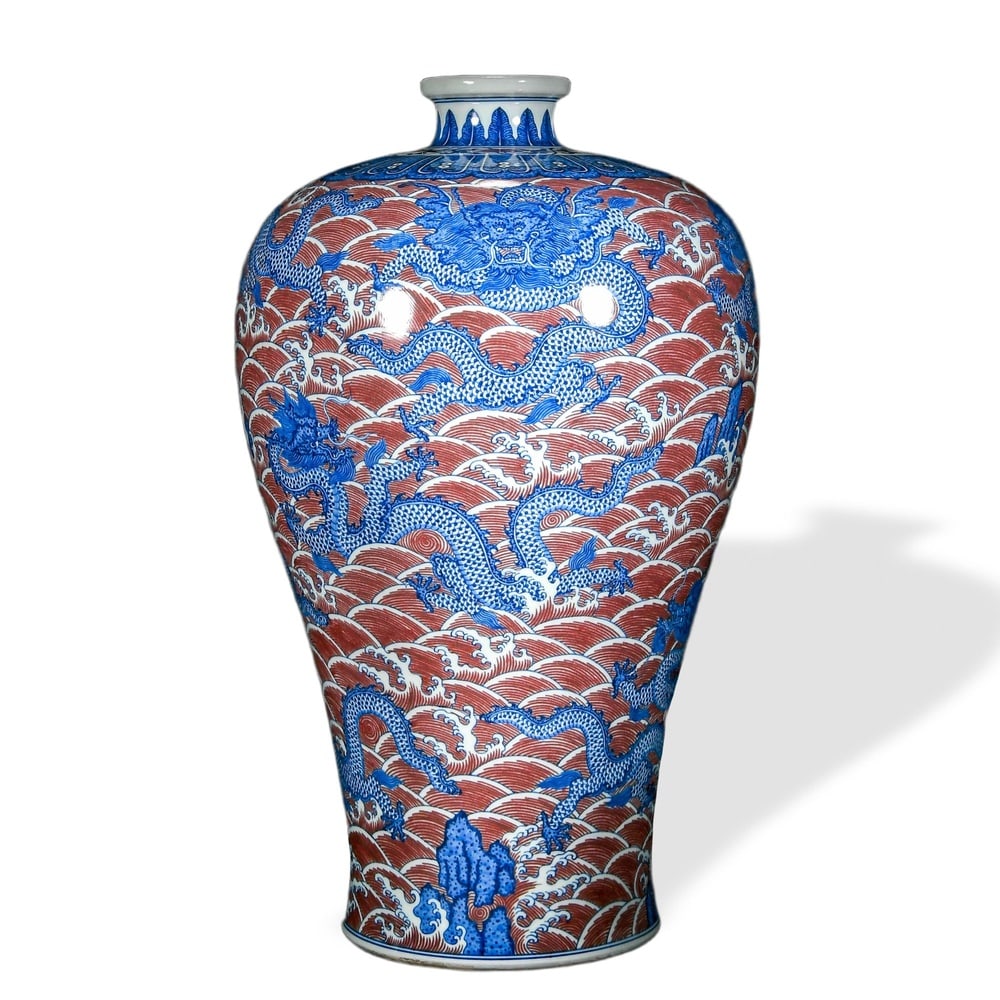 QIANLONG UNDERGLAZE BLUE AND COPPER-RED 'DRAGONS AMONG SEA WAVES' MEIPING VASE: Qianlong Underglaze Blue and Copper-Red 'Dragons Among Sea Waves' Meiping Vase Dimensions: H: 20 in (51 cm); W: 11 1/2 in (29 cm) This commanding meiping vase exemplifies the most ambitious format of