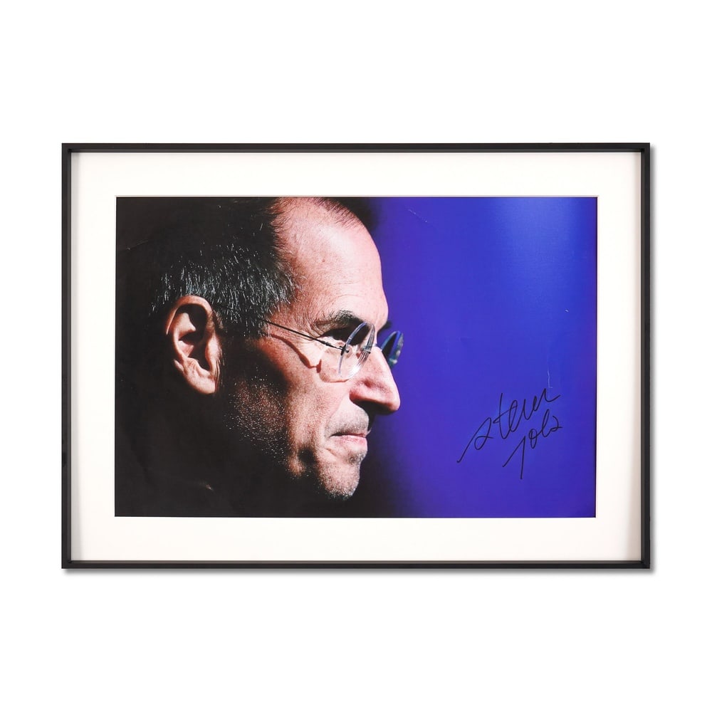 STEVE JOBS SIGNED POSTER: Sight Size: 20 1/8 x 13 1/4 in (51.1 x 33.7 cm) Frame Size: 24 1/2 x 17 5/8 in (62.2 x 44.7 cm) Offered here is an exceptionally rare autographed poster signed by Steve Jobs, the iconic co-founder of 