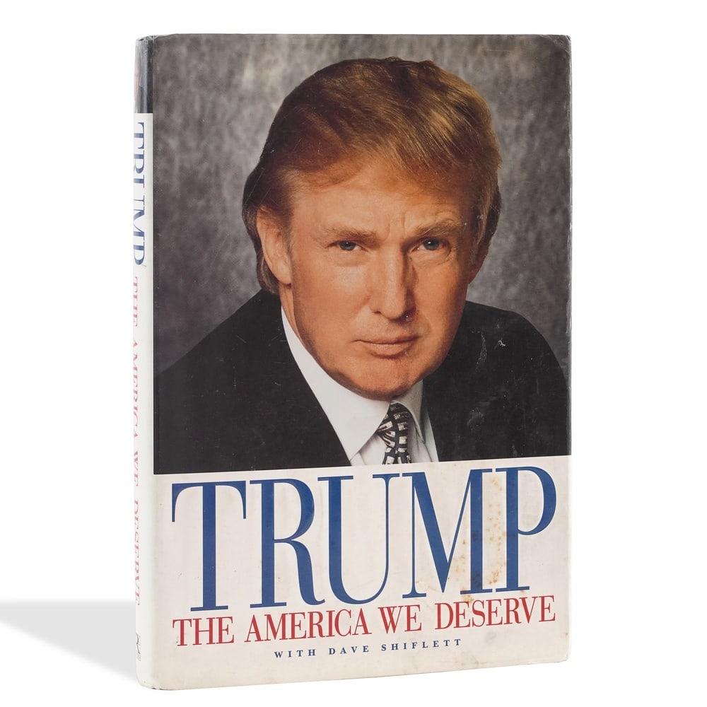DONALD J. TRUMP SIGNED "THE AMERICA WE DESERVE" FIRST EDITION: 9 1/4 x 6 1/2 in (23.5 x 16.5 cm) Provenance and Authentication: This collectible has undergone a rigorous forensic evaluation. The signatures were carefully analyzed across multiple criteria, includi