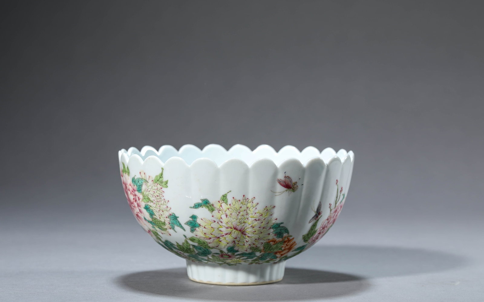 Famille Rose Butterfly and Flower Chrysanthemum Petal Bowl: Famille Rose Butterfly and Flower Chrysanthemum Petal Bowl; Mark/Period: Yongzheng mark, Qing dynasty; Material: Porcelain; Category/Finish: Famille rose; Dimensions/Weight: Diameter 15.3 cm, Height 8