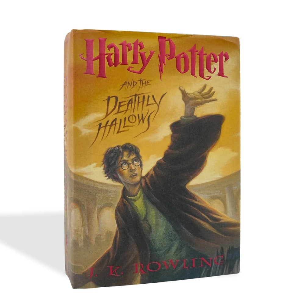 J. K. ROWLING SIGNED HARRY POTTER AND THE DEATHLY HALLOWS FIRST EDITION, FIRST PRINTING: 9 1/4 x 6 3/8 in (23.5 x 16.3 cm) J. K. Rowling (b. 1965) is one of the most influential authors of modern literature. Her Harry Potter series has become a global cultural phenomenon, captivating hund