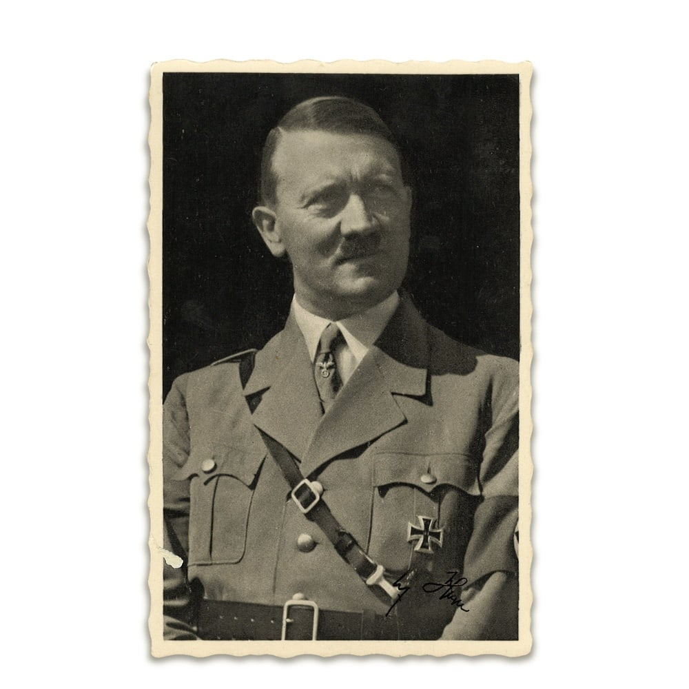 ADOLF HITLER SIGNED POSTCARD: 5 1/2 x 3 5/8 in (14.1 x 9.1 cm) This signed photographic postcard represents a historically significant piece of twentieth-century memorabilia, bearing the handwritten signature of Adolf Hitler. The