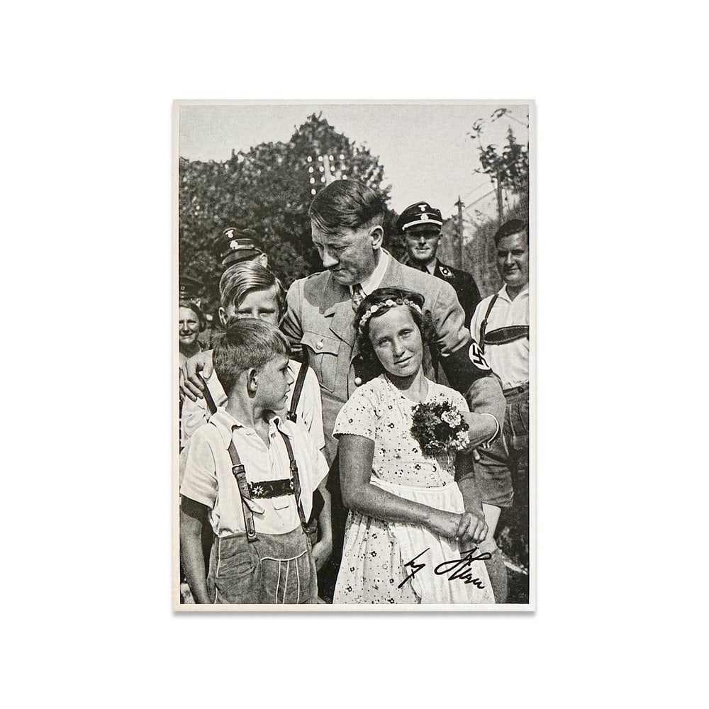 ADOLF HITLER SIGNED PROPAGANDA COLLECTOR CARD(CHILDREN SCENE, SAMMELWERK NR.15): 6 5/8 x 4 5/8 in (16.8 x 11.8 cm) A signed Adolf Hitler propaganda collector card depicting him interacting with children represents a distinct and psychologically charged category within Third Reich 