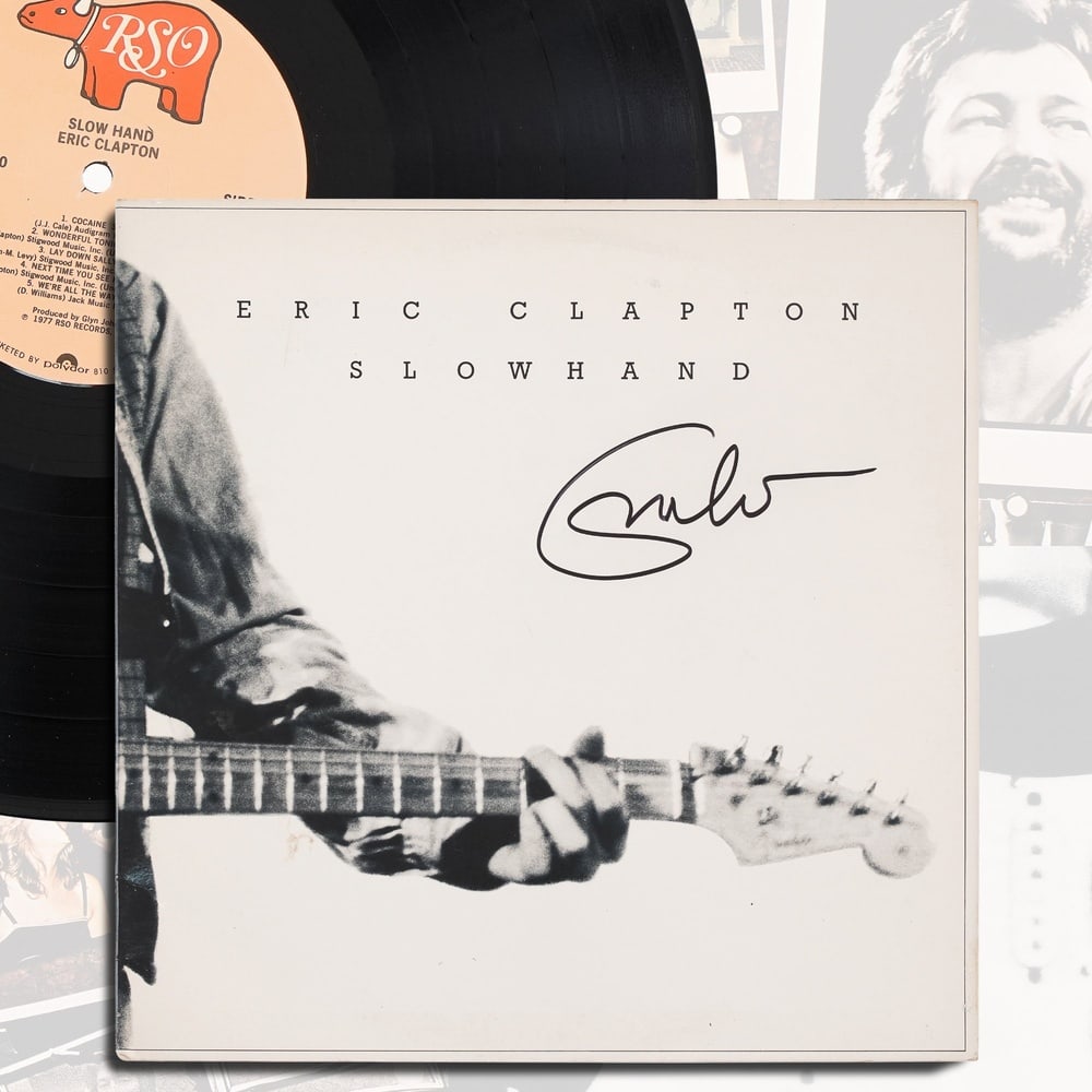 ERIC CLAPTON SIGNED "SLOWHAND" LP: 12 1/4 x 12 1/4 in Provenance and Authentication: This collectible has undergone a rigorous forensic evaluation. The signatures were carefully analyzed across multiple criteria, including ink