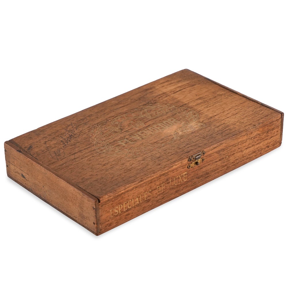 FIDEL CASTRO SIGNED CIGAR BOX - EL VENCEDOR: 8 1/2 x 5 1/4 in (21.7 x 13.2 cm) This signed cigar box represents one of the most symbolically charged categories of political memorabilia associated with Fidel Castro. Few objects are more closely i