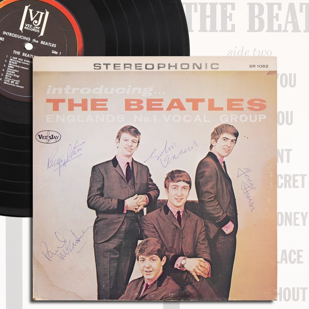 THE BEATLES FULLY SIGNED "INTRODUCING... THE BEATLES" LP: 12 1/4 x 12 1/4 Provenance and Authentication: According to the Letter of Authenticity (LOA) and Certificate of Authenticity (COA) provided by the consignor, this collectible was subjected to a forens
