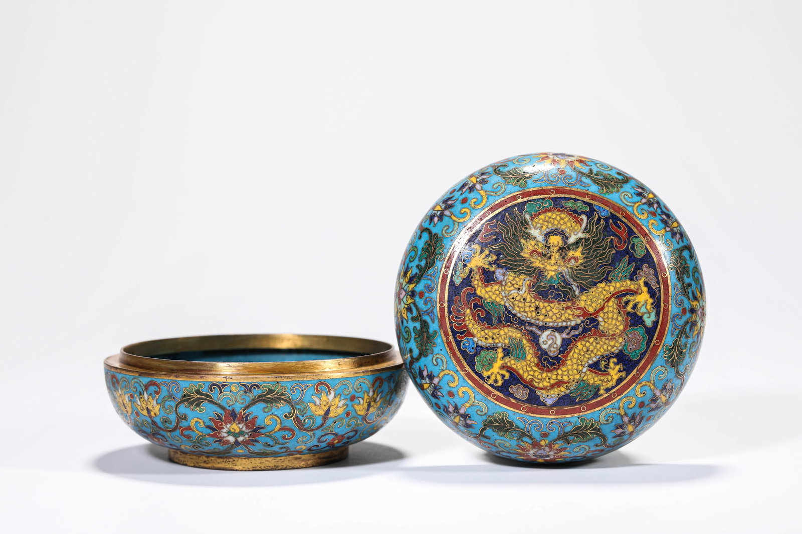 Cloisonne Enamel on Copper Covered Box with Flowers and Dragons: Cloisonne Enamel on Copper Covered Box with Flowers and Dragons. Material / medium: Copper. Mark: "Made during the Qianlong reign." Weight: 424 g. Width: 10.3 cm. Height: 6.4 cm.