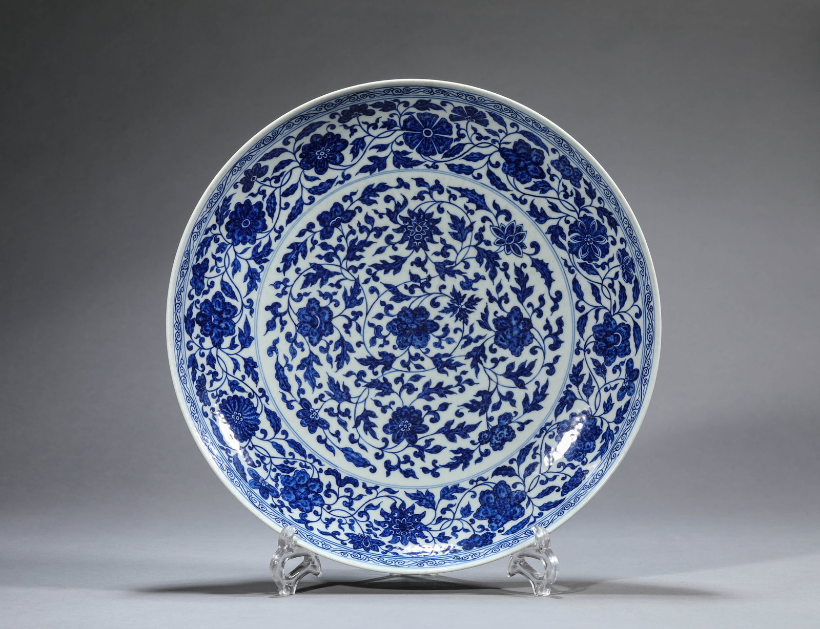 Large Blue and White Dish with Lotus Scrolls: Large Blue and White Dish with Lotus Scrolls. Material / medium: Porcelain. Mark: "Made during the Yongzheng reign of the Great Qing dynasty." Diameter: 35.5 cm. Height: 5.5 cm.