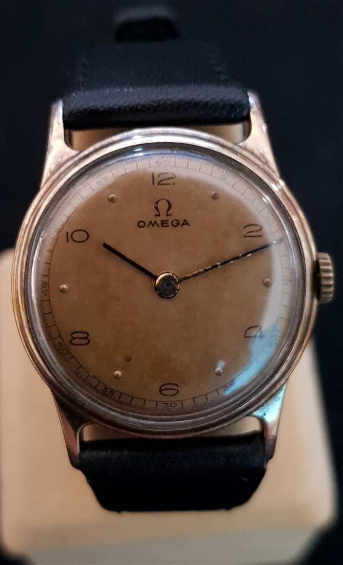 Omega 1939 Aged Pilot Dial 14kt GF Watch: Omega 14kt GF.Running nice and smooth.Double signed Omega, Case, Movement.Comes with leather unworn strap.Serial: 971647 circa 1939Case No: 9028300Diameters: 30mmx36.8mm incl crown Bracelet length is 