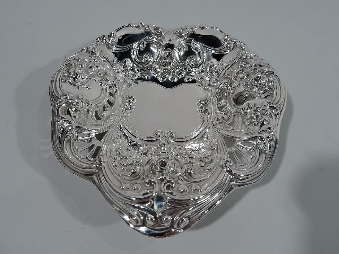 Exuberantly Romantic Antique Sterling Silver Heart Bowl: Art Nouveau sterling silver heart bowl. Made by Gorham in Providence in 1907. Exuberantly romantic heart with fluid scrolls, flowers, and pierced fans. Scrolled cartouche well vacant for engraving a s