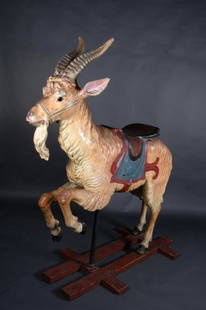 Fine and Rare Dentzel Carousel Goat: A hand carved and painted full size, all wood carousel goat by the Dentzel&nbsp;Co., Philadelphia, PA, c. 1910. Painted in light brown shading to white, with realistic expression, horns, and beard, wi