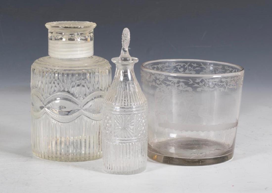 Lot of Antique Glass: Comprising an English Georgian Cut Tea Caddy, Early mold blown stoppered scent flask and an acid etched armorial wine rinser.