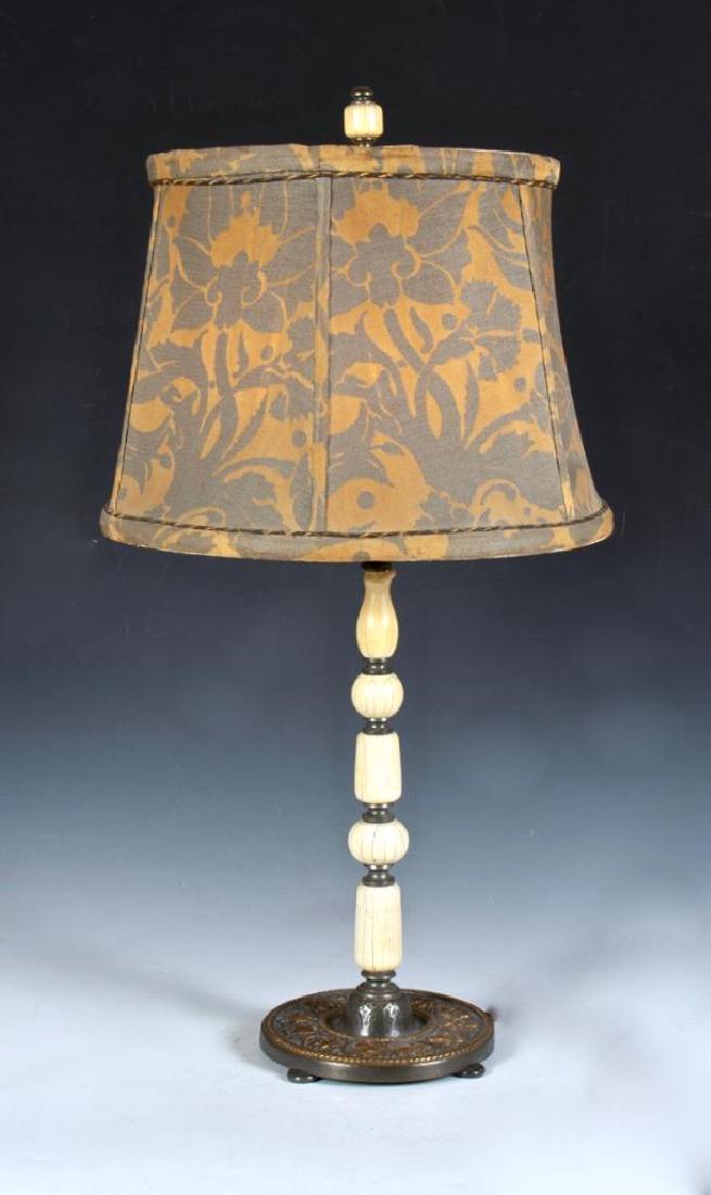 Cassidy and Company, New York Zodiac Lamp: With segmented bone standard and circular foot decorated with the signs of the zodiac in relief in gilding. Unsigned. 16 in.h. Cassidy and Company often worked with Tiffany and Co. collaborating