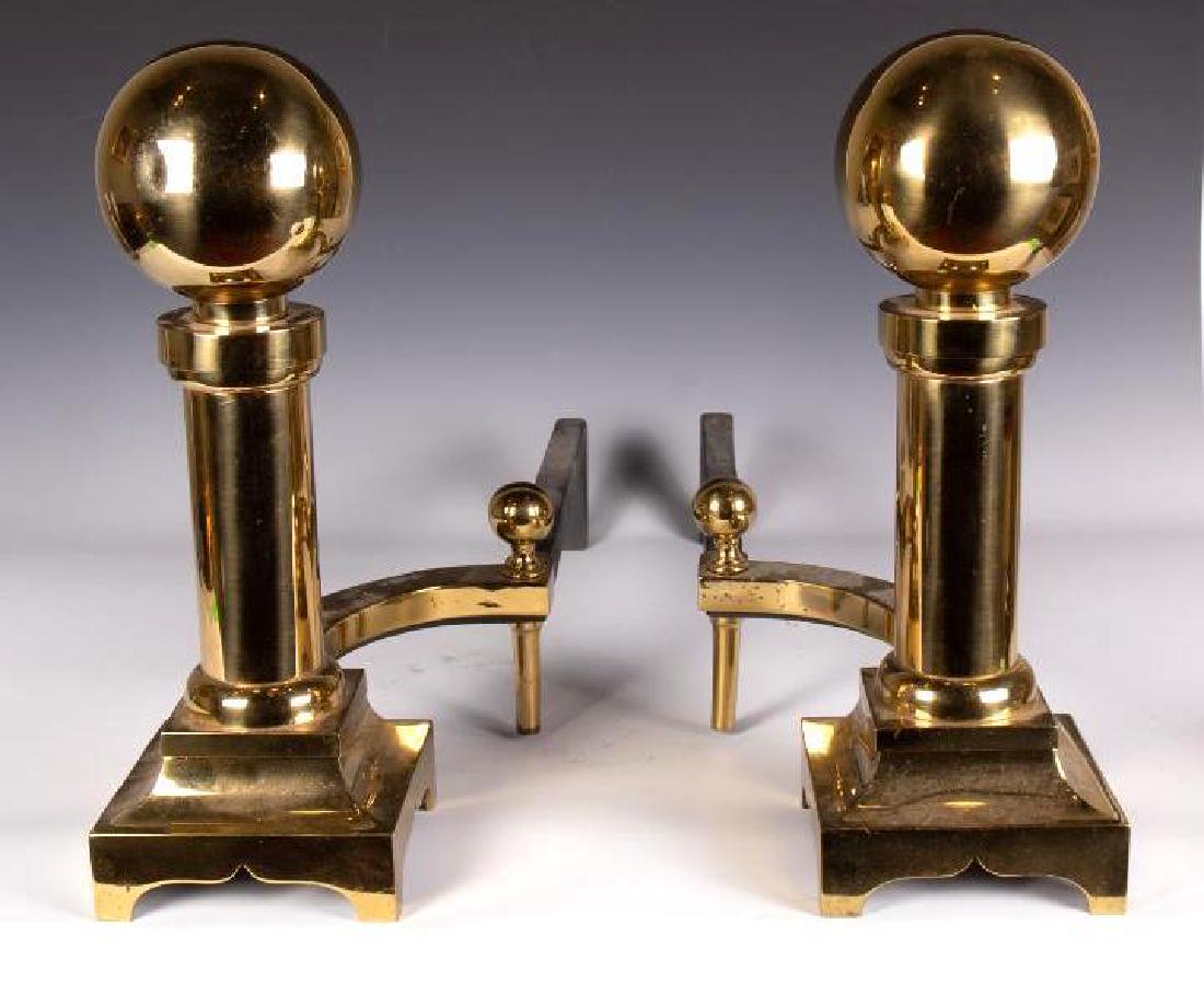 Pair of Brass Andirons: Globe and column form on stepped squared bases. 17 in. h x 26 in. d. 