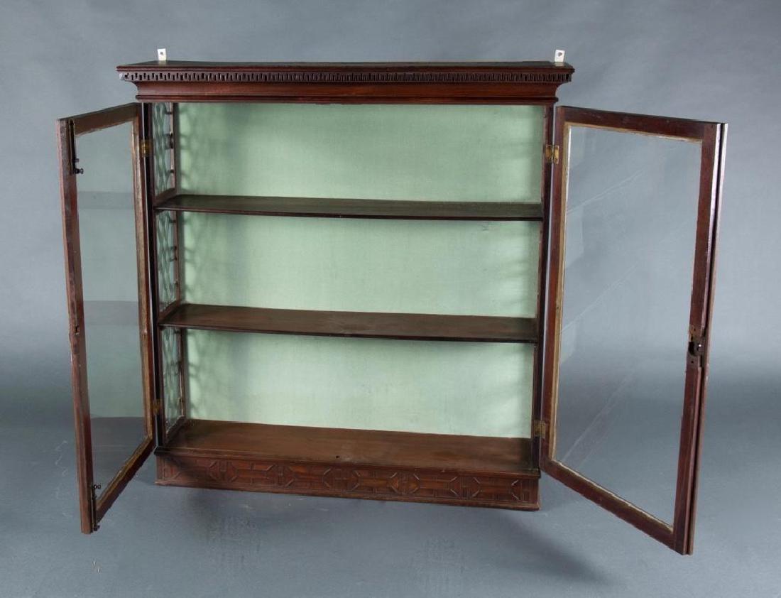 Chippendale Mahogany Hanging Vitrine: With dentil molded cornice over a pair of hinged glazed doors, the sides glazed and overlaid with fretwork, the base decorated with fretwork, original lock and key present but need to be installed, ol