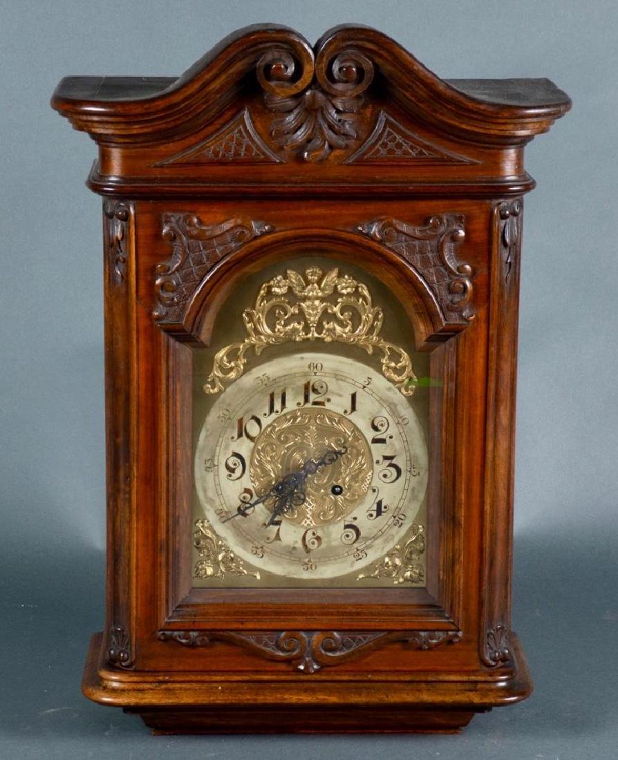 Country French Case Clock Bonnet: Case clock bonnet offered on stained oak shelf, swan neck crest over high polished brass dial supports with raised relief, Arabic numerals, and not known if in working order. 25 x 17 x 6.5 in.