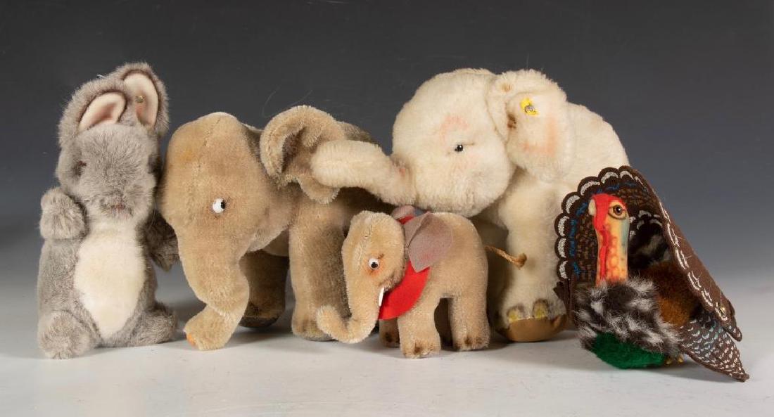 Five Steiff Animals: Plush elephant, large mohair elephant, small mohair elephant, Tucky turkey and plush rabbit. 8 in. h. tallest 