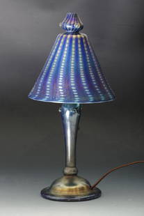 Tiffany Studios Favrile Boudoir Lamp, ca. 1920's: Bell shape dotted and pulled with applied glass jewels on finial top. Iridescence finish over purple, etched signature on the inside "L.C.T. Favrile". Base with squat bell shaped base, baluster center