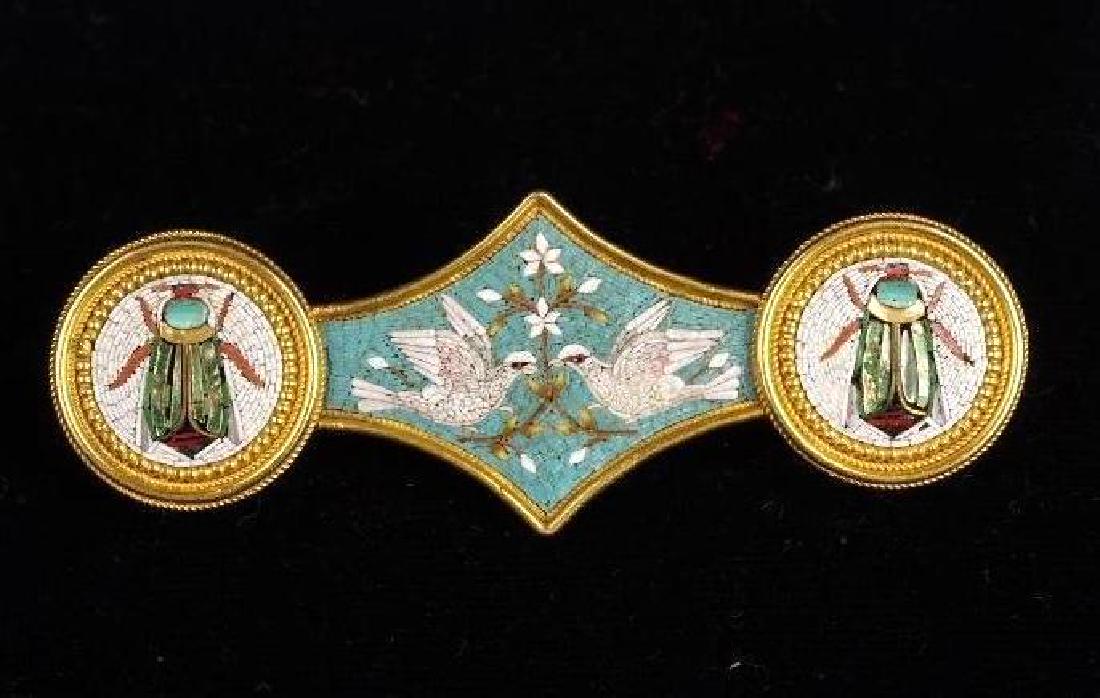 Italian Grand Tour Micro Mosaic and Gold Brooch: Mid 19thc, decorated in micro-mosaic with two scarab beetles with iridescent wings in roundels centering a pair of confronted doves clutching a flowering branch, with finely granulated border. Closes 