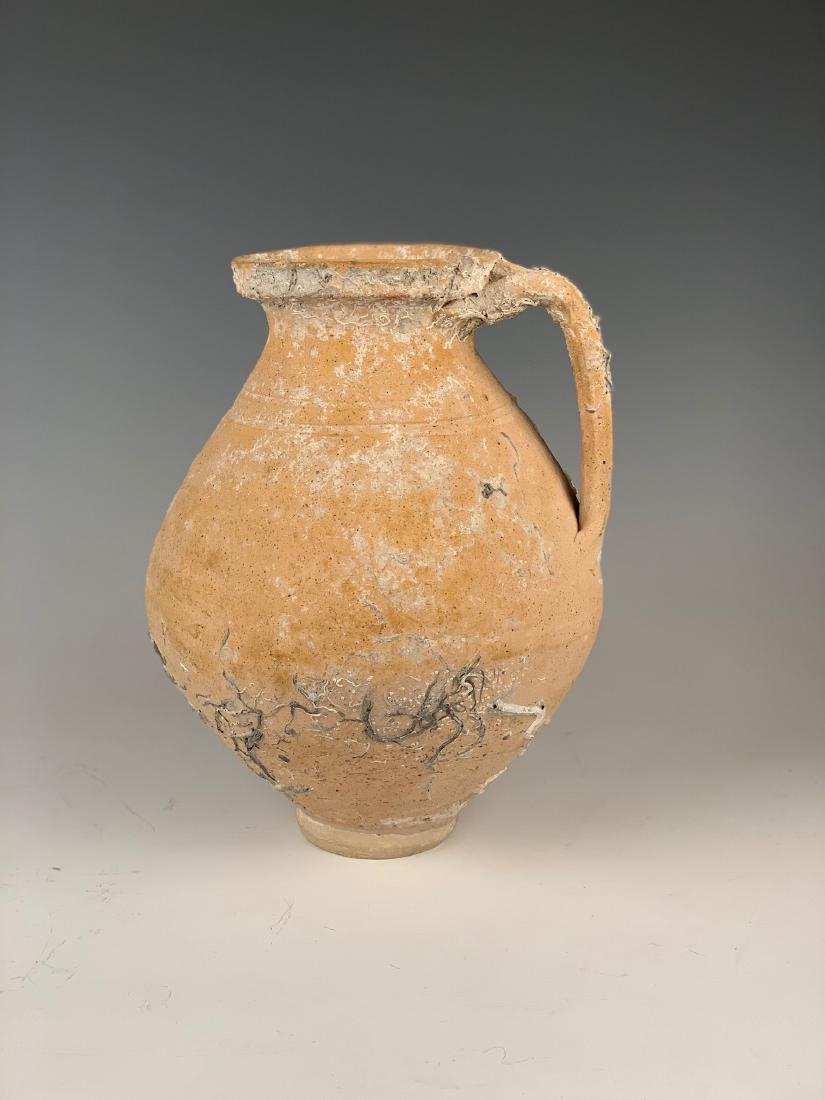 Shipwreck Roman Period Pottery Amphora 2nd-3rd Cen. AD: Greek Roman fired clay large jar, with intact handle with biconical rim moulding, ovoid body on small foot. Sea bed encrustations. No visible traces of paint or further decoration, ca. 2nd-3rd century