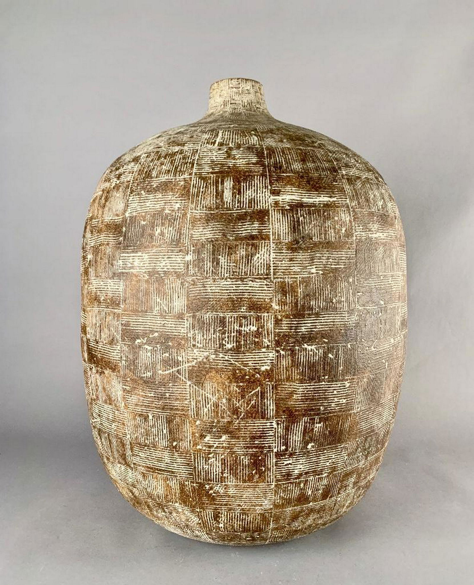 Claude Conover (American, Cleveland School,1907-1994): Claude Conover (American, Cleveland School,1907-1994) Large ovoid stoneware vessel, decorated with an allover pattern of rectangular forms with opposing crosshatchings. 23 in.h. Condition: A handful o