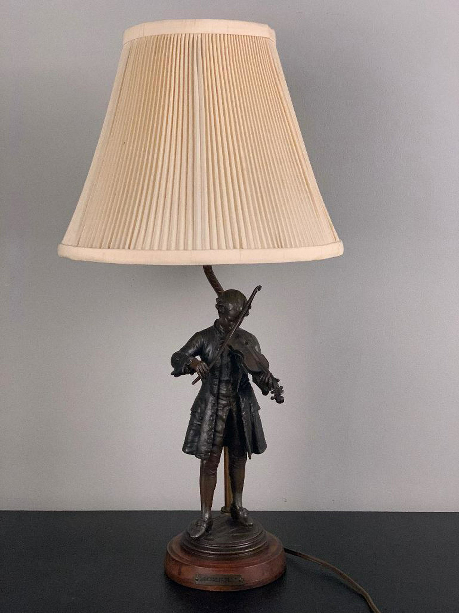 Leon Gregoire (French 1840-1890) Young Mozart Playing: Leon Gregoire (French 1840-1890) Young Mozart playing the Violin, patinated white metal, signed Gregoire, with foundry mark, Reduction Mechanique, Made in France, fitted as a table lamp, on wood base.